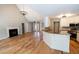 Spacious living room featuring hardwood floors, fireplace and an open floor plan concept at 1200 Martins Chapel Se Ln, Lawrenceville, GA 30045