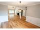 Living room with hardwood floors, neutral colors, and modern light fixtures at 1200 Martins Chapel Se Ln, Lawrenceville, GA 30045