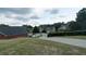 Neighborhood street view with well-maintained landscaping and lawns at 1200 Martins Chapel Se Ln, Lawrenceville, GA 30045