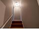 Stairway with wooden steps and a white banister leading upstairs at 1200 Martins Chapel Se Ln, Lawrenceville, GA 30045