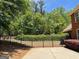 Fenced backyard featuring well-maintained lawn and manicured landscaping, enhancing privacy and beauty at 1209 Persimmon Way, Mcdonough, GA 30252