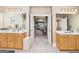 Open bathroom layout featuring and vanities, with a walk through door at 1209 Persimmon Way, Mcdonough, GA 30252