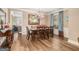 Dining room with a chandelier, large windows, and view of living room at 1209 Persimmon Way, Mcdonough, GA 30252