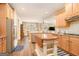 Spacious kitchen with a center island, stainless steel appliances, and wood cabinets at 1209 Persimmon Way, Mcdonough, GA 30252
