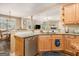 Open concept kitchen with stone countertops, stainless appliances, and breakfast bar seating at 1209 Persimmon Way, Mcdonough, GA 30252