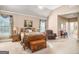 Comfortable main bedroom with a large bed, natural light, and cozy sitting area, perfect for relaxation at 1209 Persimmon Way, Mcdonough, GA 30252