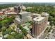 Expansive aerial view of the Brookwood community with lush trees, pool, and the city skyline in the distance at 1820 Peachtree Nw St # 1008, Atlanta, GA 30309