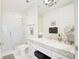 Modern bathroom with marble countertop, glass-enclosed shower, and elegant fixtures at 1820 Peachtree Nw St # 1008, Atlanta, GA 30309