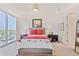 Cozy bedroom with a large window offering city views and ample natural light at 1820 Peachtree Nw St # 1008, Atlanta, GA 30309
