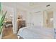 Bedroom with closet doors leading into the bathroom and hardwood floors at 1820 Peachtree Nw St # 1008, Atlanta, GA 30309