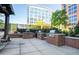 Outdoor grilling area featuring built-in brick stations and well-maintained surroundings near common areas at 1820 Peachtree Nw St # 1008, Atlanta, GA 30309