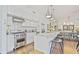 Bright kitchen features stainless steel appliances, granite countertops, and a central island with bar stool seating at 1820 Peachtree Nw St # 1008, Atlanta, GA 30309