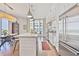 Bright kitchen and dining area with a center island, sleek pendant lights, and a balcony view at 1820 Peachtree Nw St # 1008, Atlanta, GA 30309