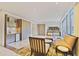 Bright living room with a wet bar, comfortable seating, and floor-to-ceiling windows, showcasing stylish living at 1820 Peachtree Nw St # 1008, Atlanta, GA 30309