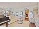 Open-concept living area boasts hardwood floors, a comfortable sofa, and abundant natural light with views of the city at 1820 Peachtree Nw St # 1008, Atlanta, GA 30309