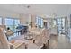 Spacious open-concept living area with hardwood floors, piano, and views, seamlessly connecting to the kitchen at 1820 Peachtree Nw St # 1008, Atlanta, GA 30309