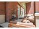 Inviting brick patio with lounge seating, a fireplace and outdoor view, ideal for relaxation at 1820 Peachtree Nw St # 1008, Atlanta, GA 30309