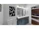 Stylish bathroom featuring a dual sink vanity with modern fixtures, next to toilet at 3021 Stone Bridge Sw Trl, Conyers, GA 30094