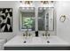 Stylish bathroom featuring a dual sink vanity with modern fixtures, next to toilet at 3021 Stone Bridge Sw Trl, Conyers, GA 30094