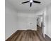 Bright bedroom boasts wood floors, white walls and trim, and a ceiling fan at 3021 Stone Bridge Sw Trl, Conyers, GA 30094