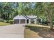 Charming one-story home with a two-car garage and well-maintained front yard at 3021 Stone Bridge Sw Trl, Conyers, GA 30094