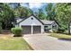 Inviting one-story home with a two-car garage, neat lawn and beautiful landscaping at 3021 Stone Bridge Sw Trl, Conyers, GA 30094