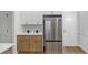 Bright kitchen featuring wood cabinets, stainless steel refrigerator, and white countertops at 3021 Stone Bridge Sw Trl, Conyers, GA 30094