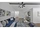 Cozy living room features a comfortable blue couch and stylish decor at 3021 Stone Bridge Sw Trl, Conyers, GA 30094