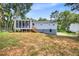 Large backyard featuring a screened in porch and grassy area at 6607 Forestdale Ln, Douglasville, GA 30135