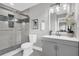 This modern bathroom features a sleek glass shower, updated vanity, and stylish decor at 6607 Forestdale Ln, Douglasville, GA 30135