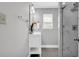 Modern bathroom with a sleek vanity, stylish mirror, and a glass-enclosed shower at 6607 Forestdale Ln, Douglasville, GA 30135
