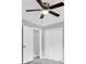 This bedroom features gray walls, neutral colored carpet and ceiling fan at 6607 Forestdale Ln, Douglasville, GA 30135