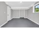 Neutral bedroom with closet and window providing natural light at 6607 Forestdale Ln, Douglasville, GA 30135