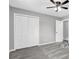 Spacious bedroom with grey walls, neutral carpeting and updated closets at 6607 Forestdale Ln, Douglasville, GA 30135