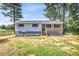 Charming single-story home with a covered front porch and freshly landscaped front yard at 6607 Forestdale Ln, Douglasville, GA 30135
