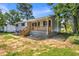 Lovely home with new siding, front porch, and landscaped yard at 6607 Forestdale Ln, Douglasville, GA 30135