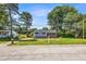 Charming front exterior with blue siding, dark shutters and a covered porch at 6607 Forestdale Ln, Douglasville, GA 30135
