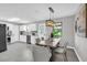 Contemporary kitchen with stainless steel appliances, granite counters, and white cabinetry at 6607 Forestdale Ln, Douglasville, GA 30135