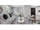 Inviting living room with a comfortable sofa, stylish decor, and plenty of natural light at 6607 Forestdale Ln, Douglasville, GA 30135