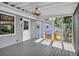 Relaxing screened porch with ceiling fan and exterior door at 6607 Forestdale Ln, Douglasville, GA 30135