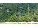 Aerial view of the property showcasing its 3.86 acres of land, surrounded by lush greenery and mature trees at 2546 N Crestview Dr, Grayson, GA 30017