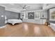 Spacious bedroom featuring a ceiling fan, recessed lights, hardwood floors, and built-in cabinets at 2546 N Crestview Dr, Grayson, GA 30017