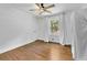 Bright and spacious bedroom featuring hardwood floors, a ceiling fan, and large windows at 2546 N Crestview Dr, Grayson, GA 30017
