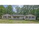 Charming single-story home with brick accents, wood shutters, and a well-manicured front yard at 2546 N Crestview Dr, Grayson, GA 30017