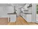 Modern kitchen featuring white cabinetry, butcher block countertops, and stainless steel appliances at 2546 N Crestview Dr, Grayson, GA 30017