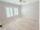 Serene bedroom with light hardwood floors, neutral walls, and plantation shutters, perfect for relaxation at 3871 Portland Trail Dr, Suwanee, GA 30024