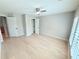 Neutral bedroom with a ceiling fan and a walk-in closet at 3871 Portland Trail Dr, Suwanee, GA 30024