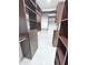 Spacious walk-in closet with custom dark wood shelving at 3871 Portland Trail Dr, Suwanee, GA 30024