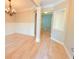 Dining room with hardwood floors, wainscotting, and chandelier lighting at 3871 Portland Trail Dr, Suwanee, GA 30024