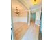 Dining room with hardwood floors, wainscotting, and chandelier lighting at 3871 Portland Trail Dr, Suwanee, GA 30024